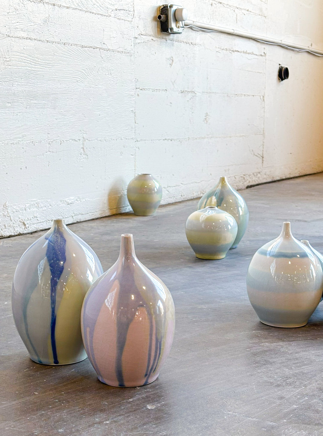 Porcelain ceramic artwork by Hugh Remar. Example pieces for an intermediate ceramics class focusing on porcelain clay making and decorating methods. 