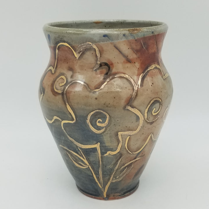Ceramic vase with decorative patterns on a white background